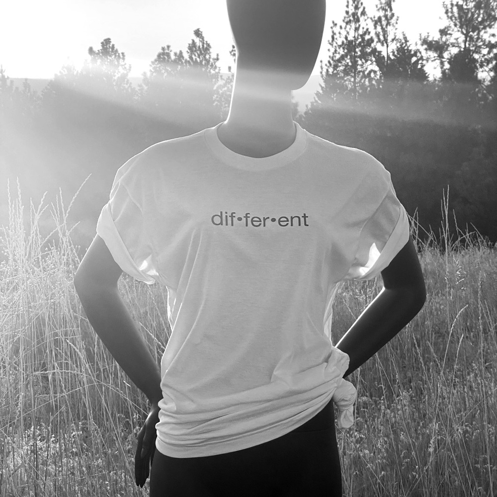 White soft tee that says Different. Custom design.
